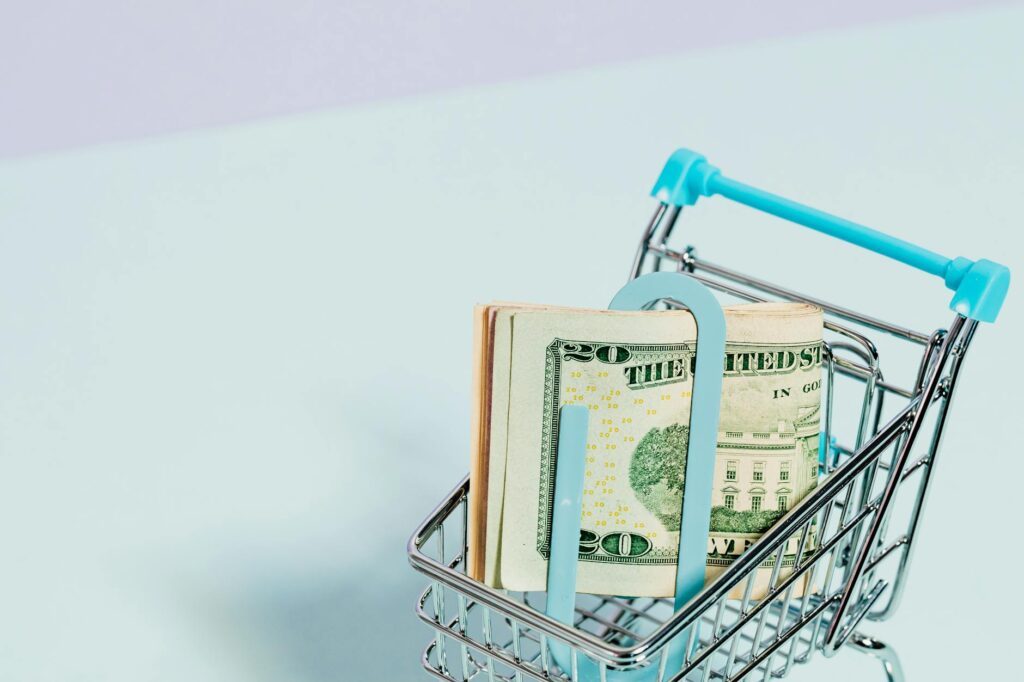 dollar bills in a cart